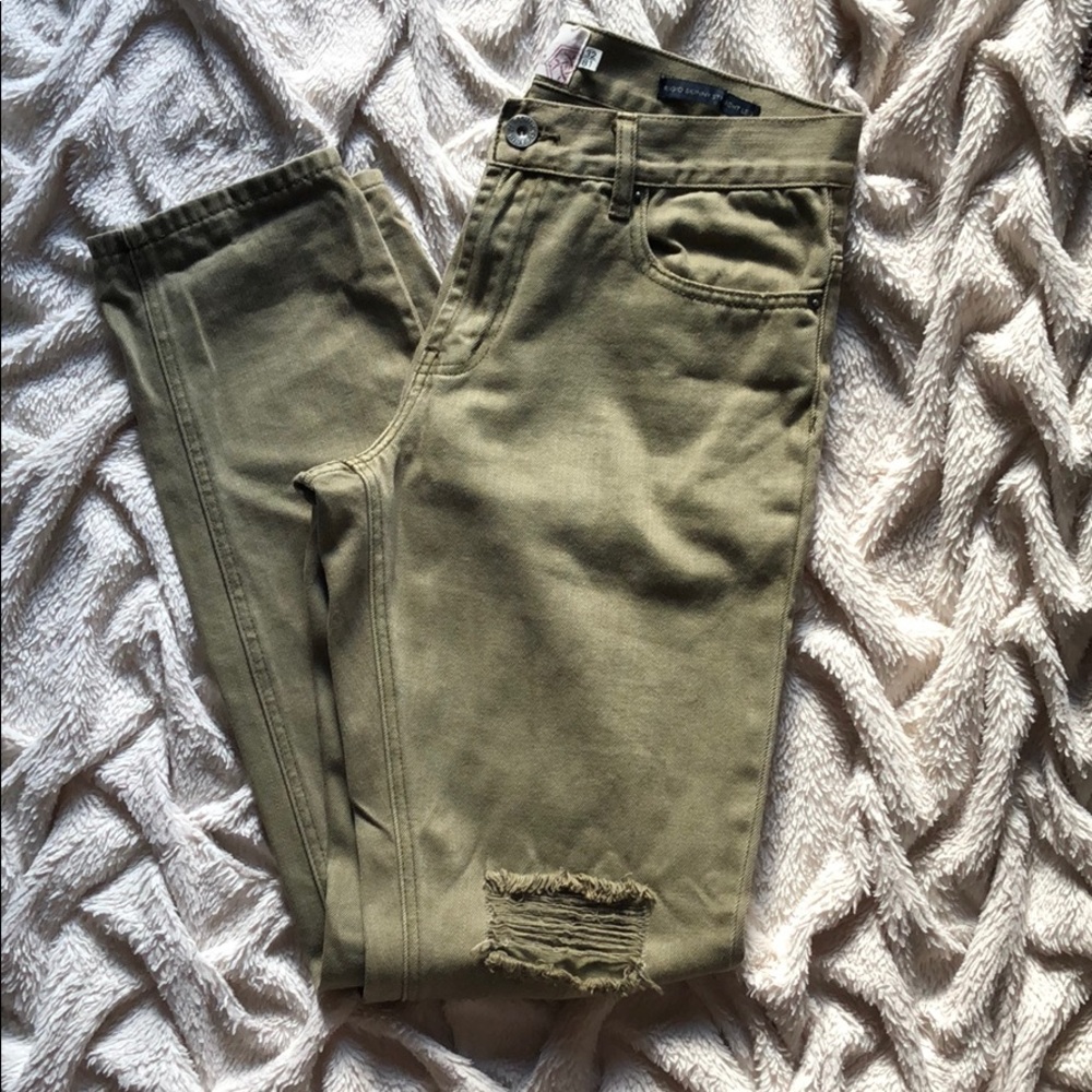 Army green denim jeans.